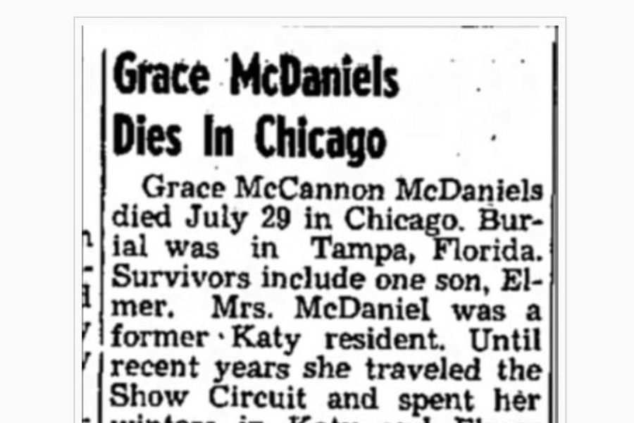 Newspaper obituary clipping with the headline “Grace McDaniels Dies in Chicago.” The text states that Grace McCannon McDaniels died on July 29 in Chicago and was buried in Tampa, Florida. She is survived by one son, Elmer. The notice mentions her previous residence in Katy and that she had spent years on the show circuit before retiring.