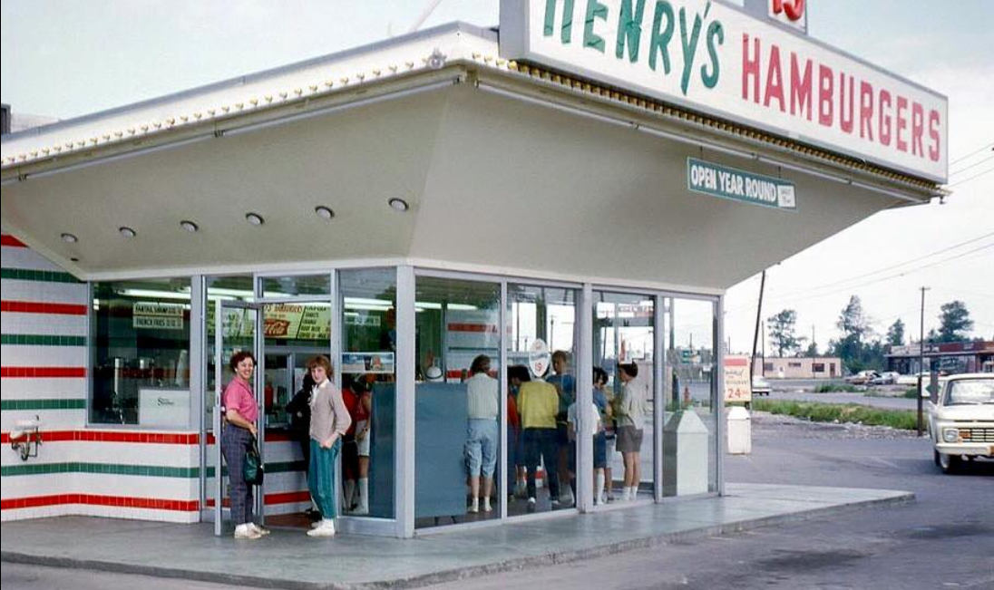 Henry's Hamburgers restaurant front with people outside, sourced from Facebook