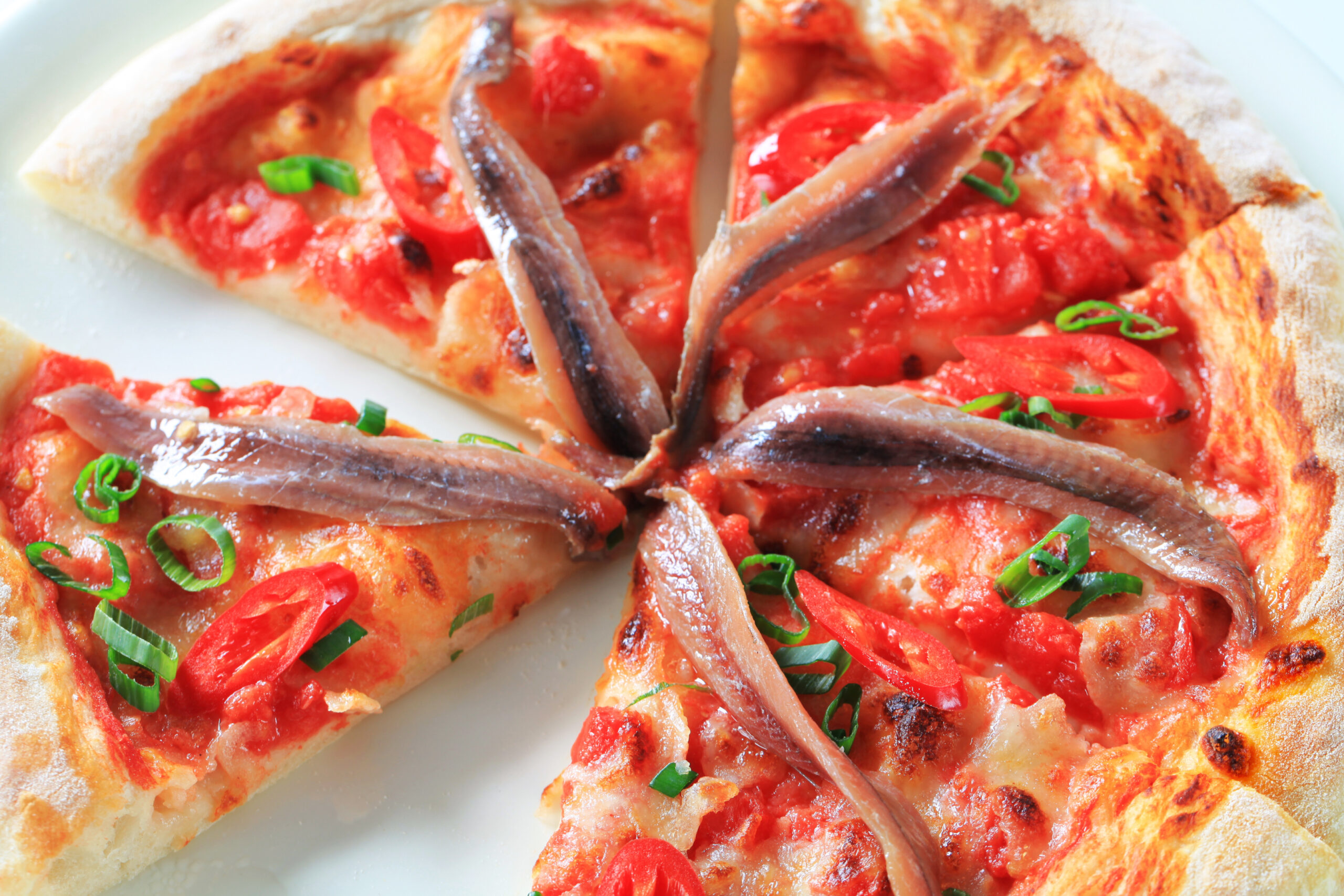 Pizza with anchovies and red pepper