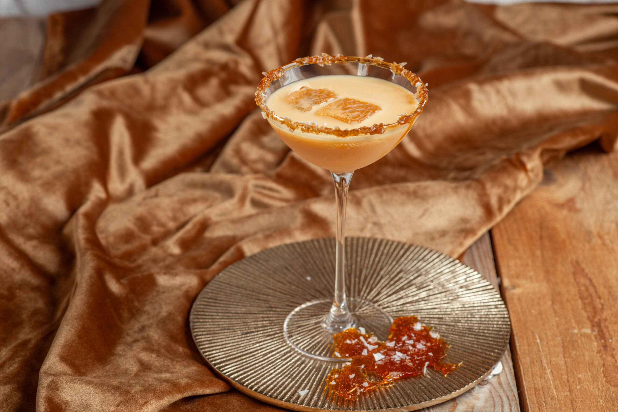 Creamy Cocktail martini salted caramel Cream liqueur with caramel rim and ice