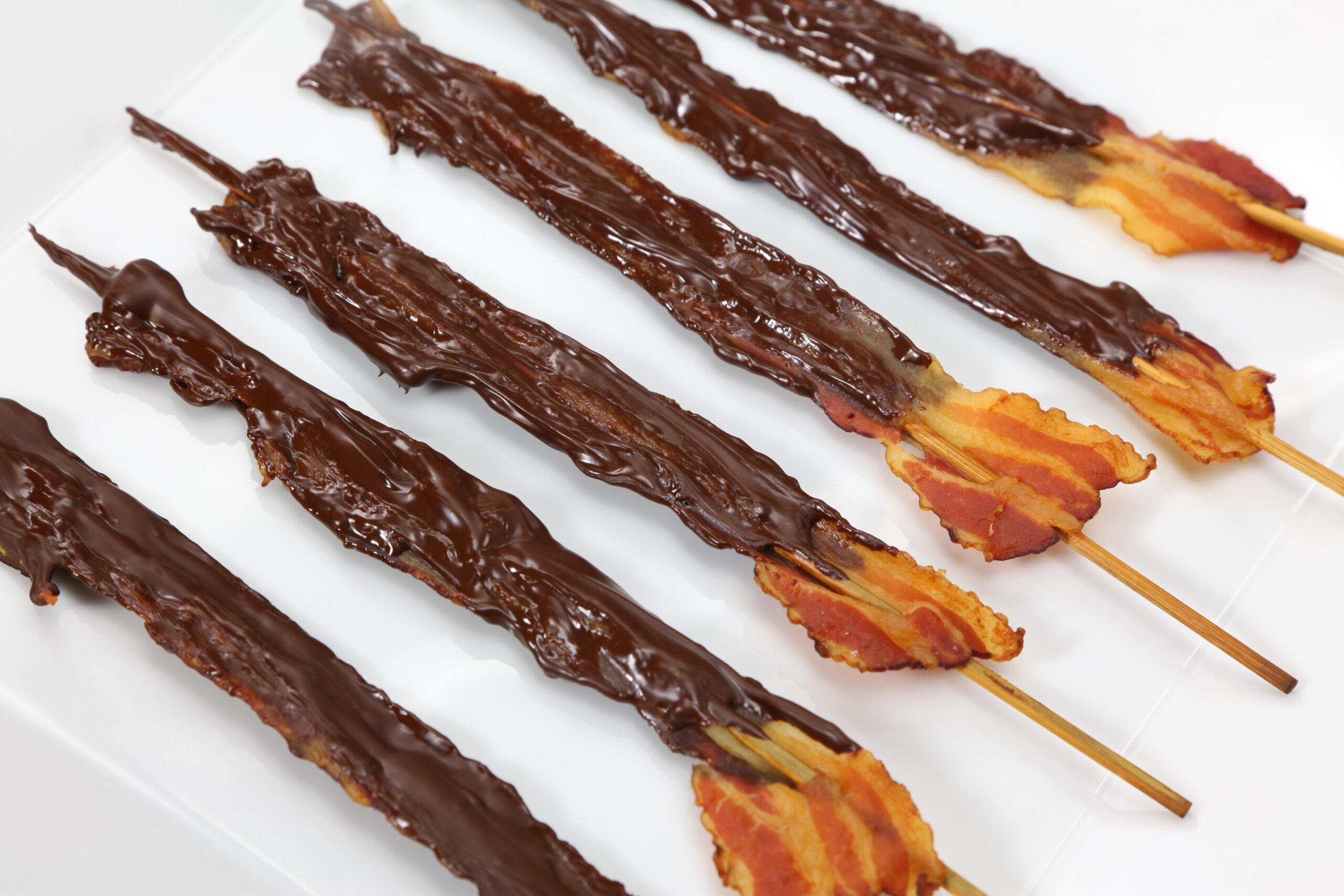 crispy Bacon dipped in chocolate on sticks