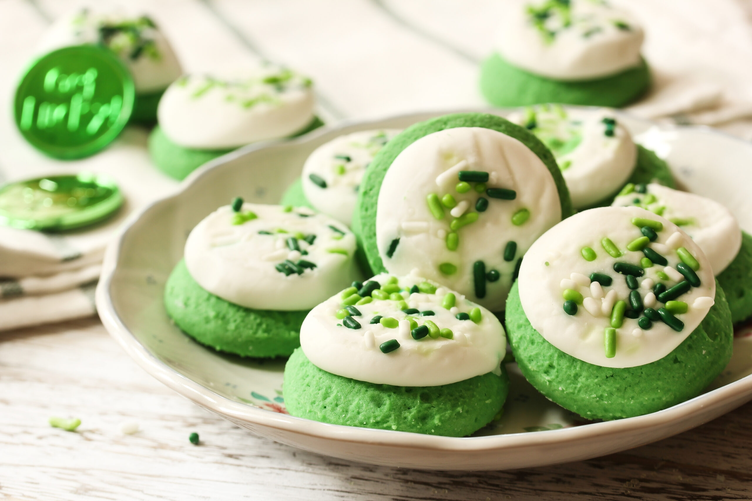 St Patrick day Green frosted  Cookies with sprinkles, selective focus