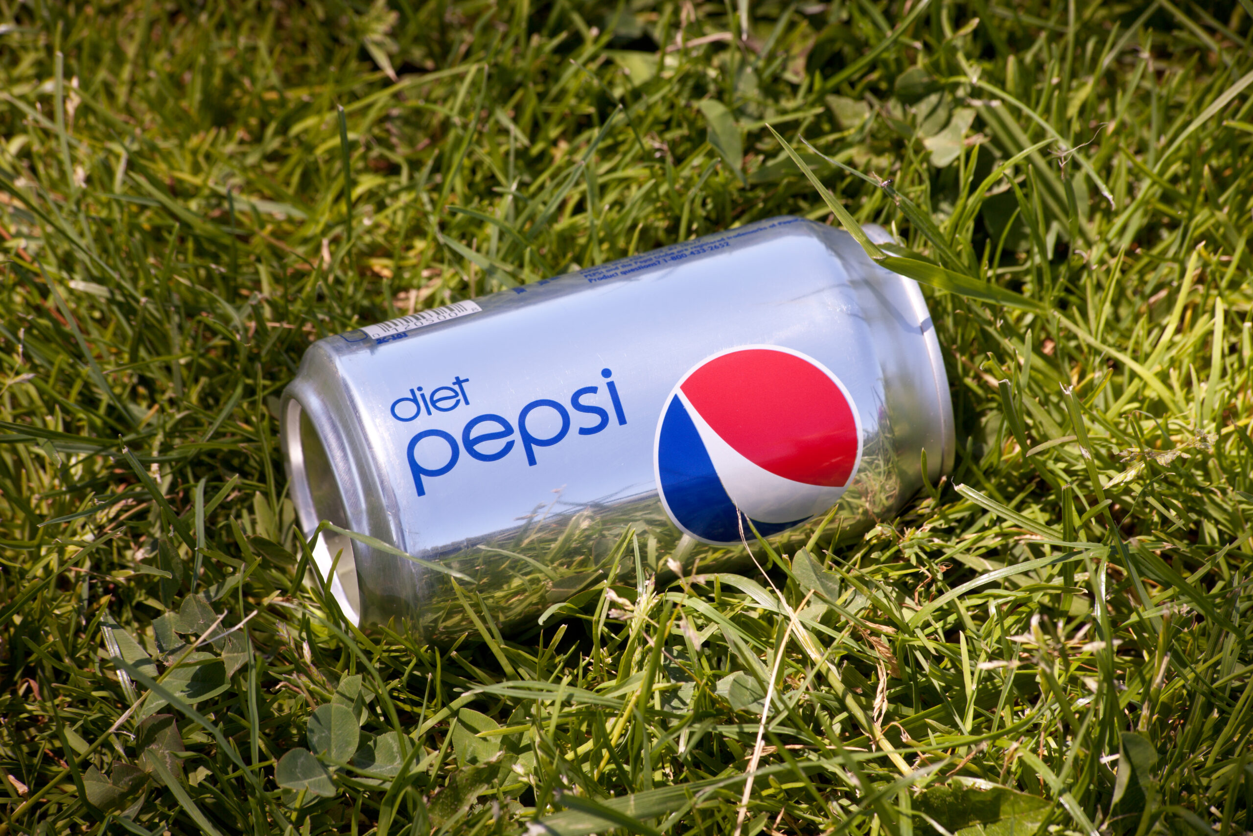 San Jose, California, USA - June 25, 2011: An outdoor product shot of a can of Diet Pepsi laying in grass. Diet Pepsi is a no-calorie soda produced by PepsiCo, Inc., introduced in 1964 as a sugar-free alternative to Pepsi-Cola.