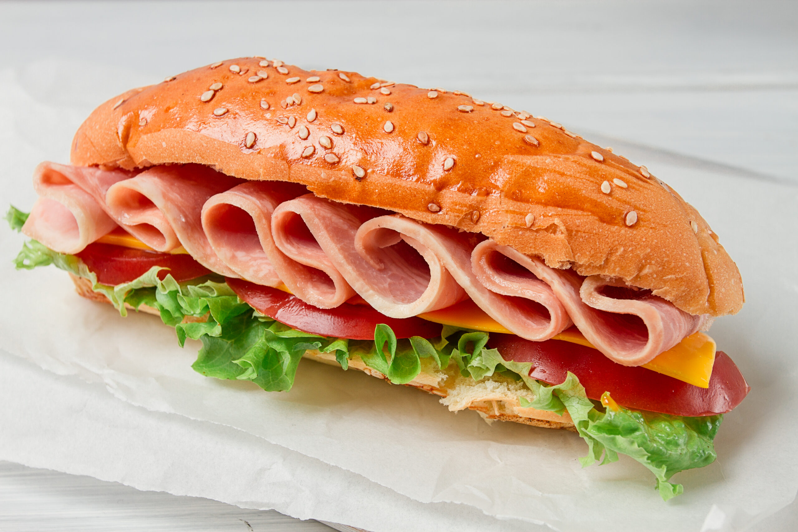 Sandwich submarine, on a white table, close-up, no people, horizontal, homemade,