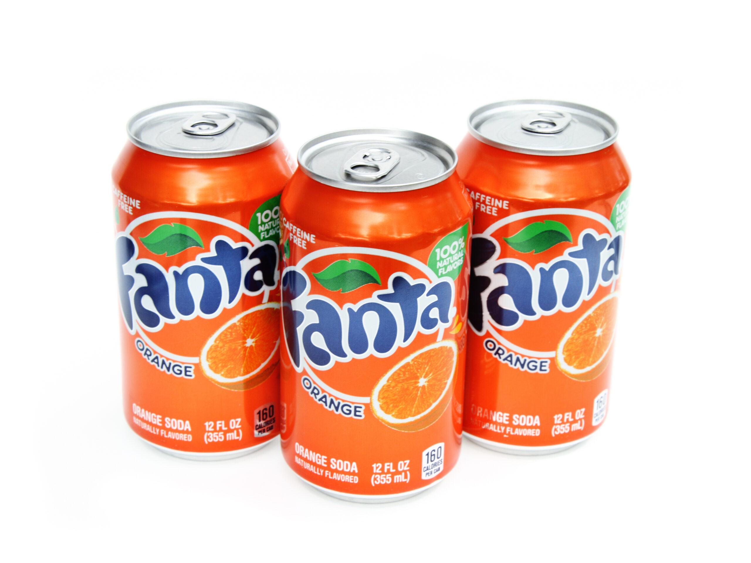 West Palm Beach, USA - December 17, 2011: This is a product shot of three cans of Fanta soda. Fanta is an orange flavored drink that is caffeine free. Fanta is a product of the Coca Cola Company.