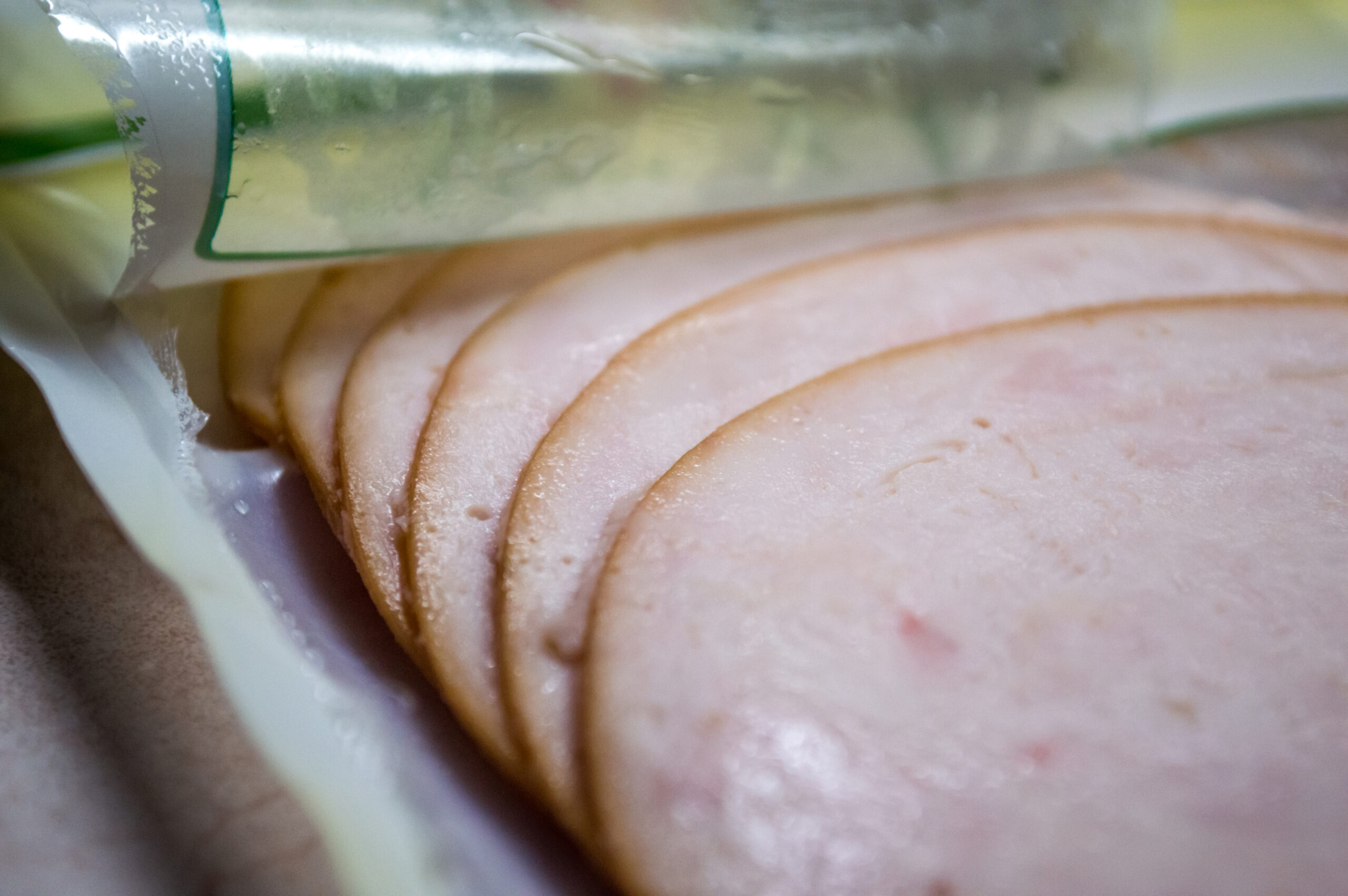 A close up image of some deli-style turkey slices, a healthy sandwich filler.