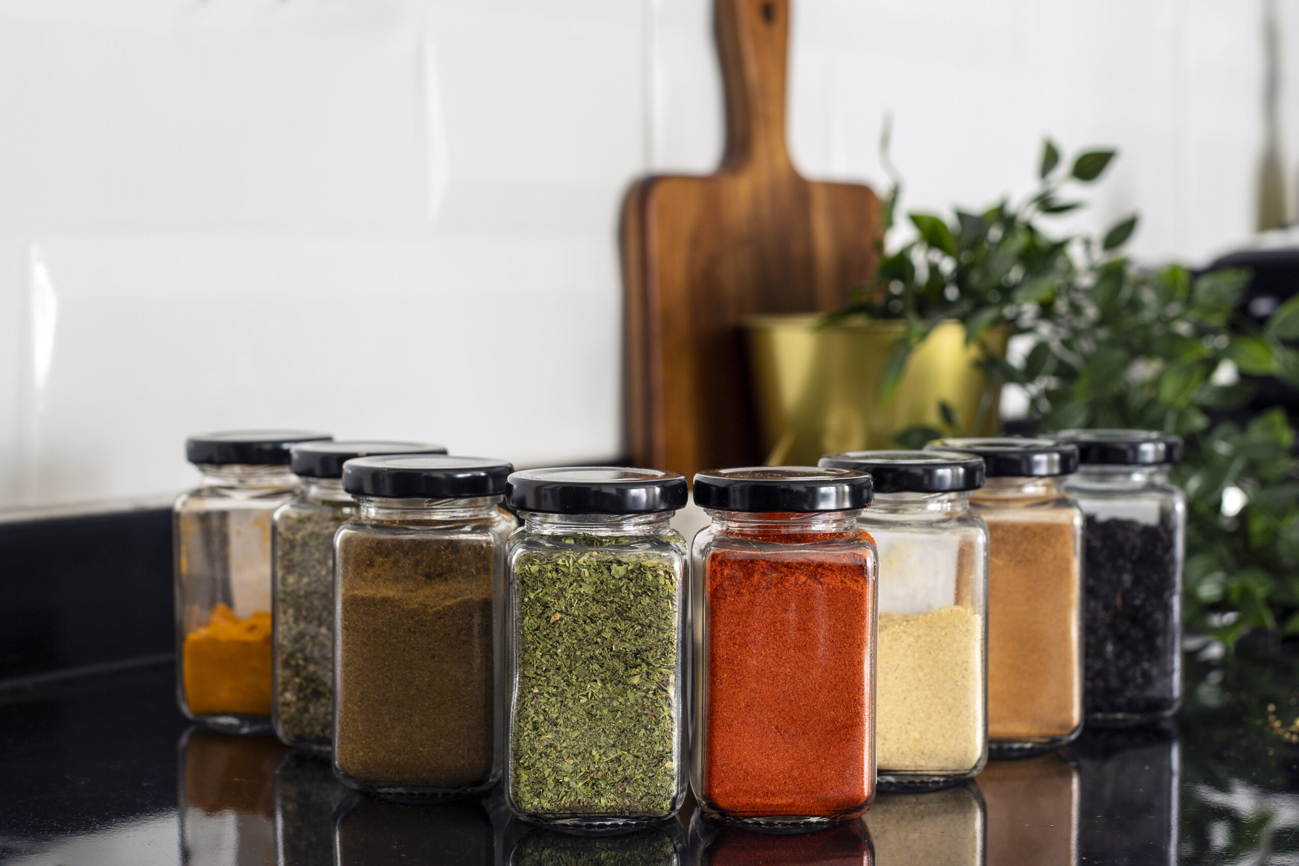 Various dried spices in glass jars