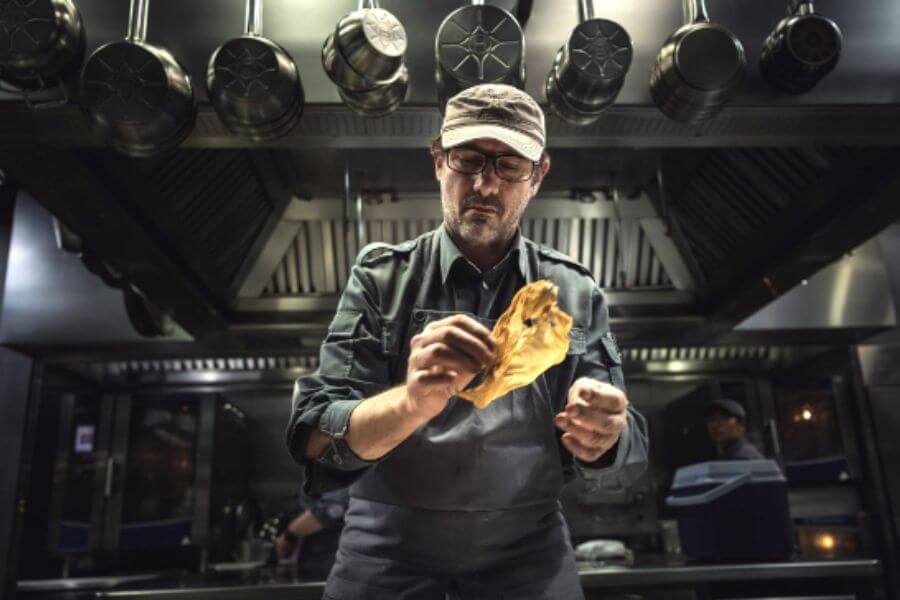 man cooking in kitchen