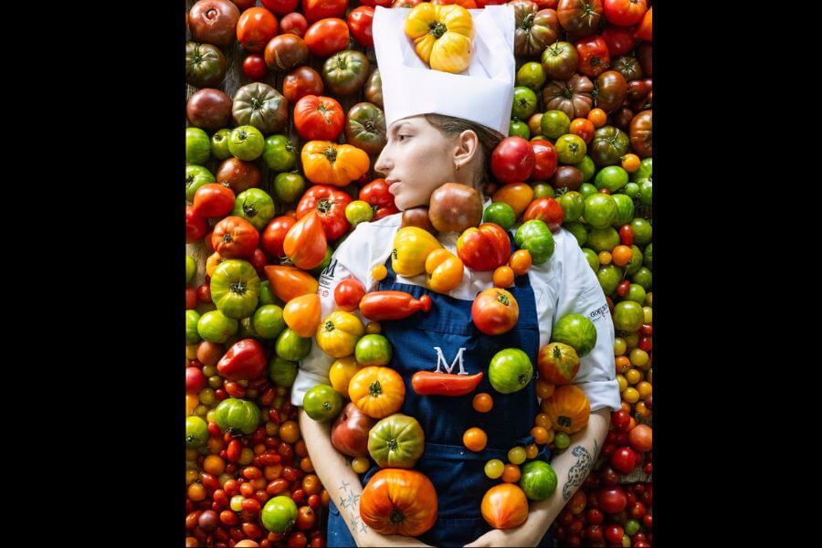 Chef covered in vegetables