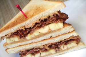 The King’s Cuisine: A Peek into Elvis Presley’s Unbelievable Diet Sandwich with bacon, banana and peanut butter, similar to the "Elvis" , but not fried