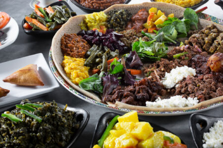 A view of assorted Ethiopian entrees, featuring a combination platter.