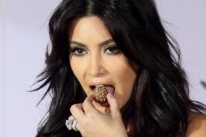 Stars’ Strangest Eating Habits: The Weirdest Celebrity Diets Kim Kardashin eatin chocolate