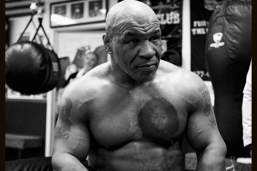 Mike Tyson in boxing gear in black and white