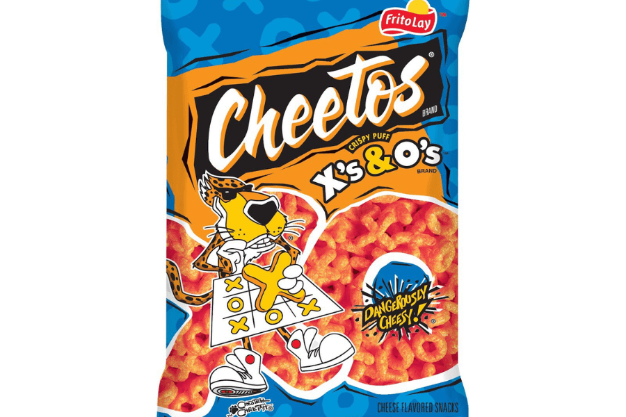 A bag of Cheetos "X's & O's" crispy puff snacks featuring a bright orange and blue design. The packaging shows Chester Cheetah playing tic-tac-toe with cheesy X and O-shaped puffs. A burst graphic reads "Dangerously Cheesy!" with a close-up of the snacks displayed at the bottom.