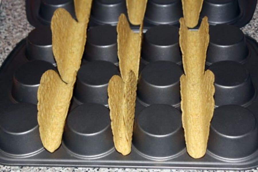 taco shells on a muffin tin