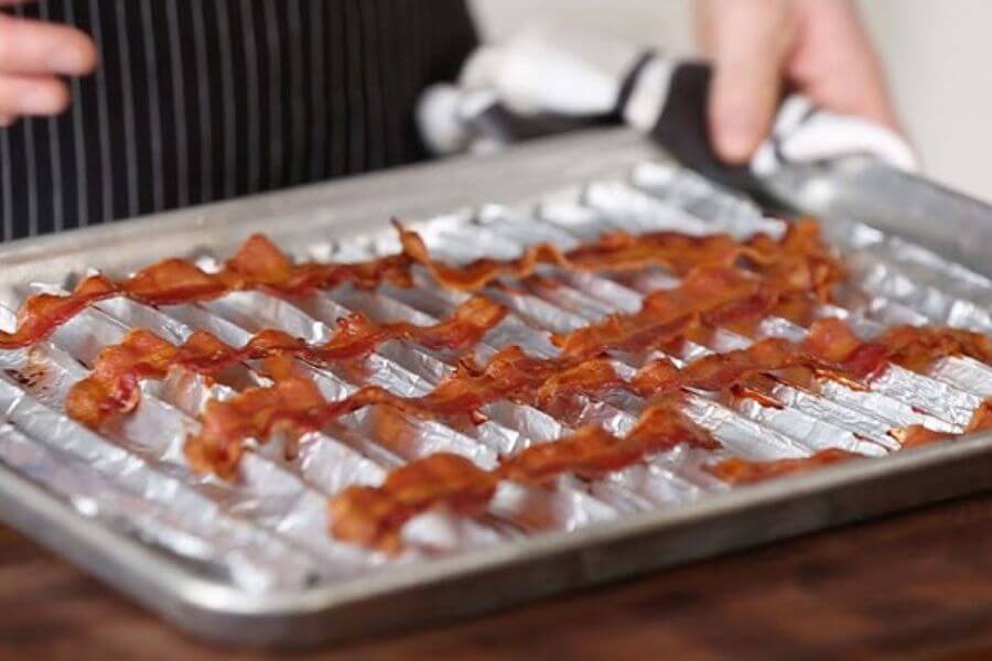 bacon on top of a bacon rack made with aluminum