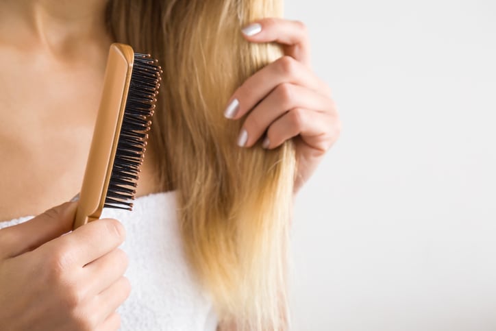 Woman brushing hair