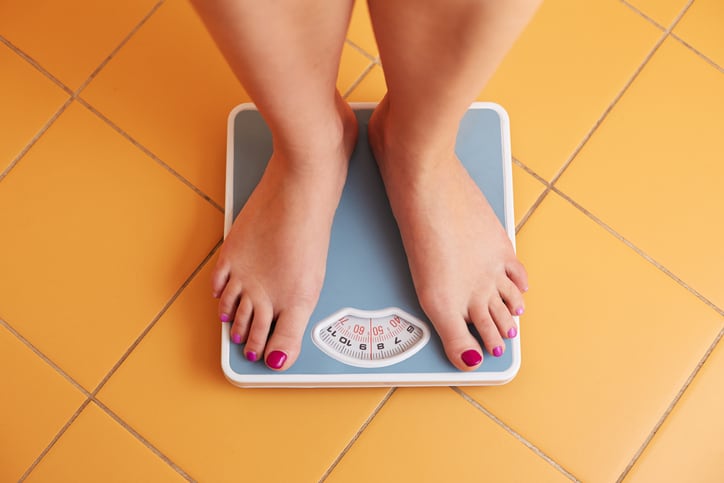 woman weighing herself