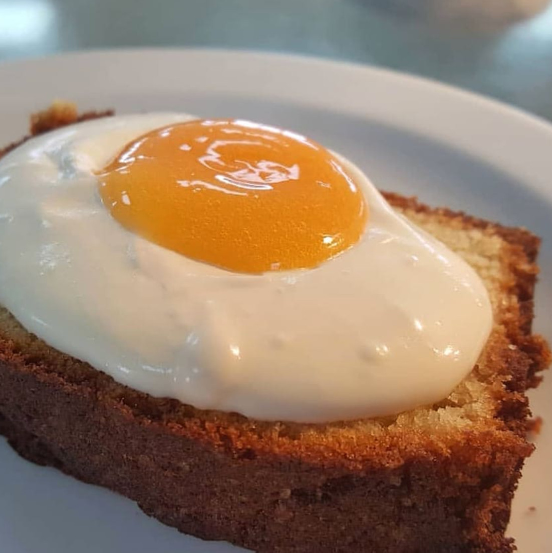 Toast with an egg on it on a white plate, food llusion from chefbenchurchill instagram