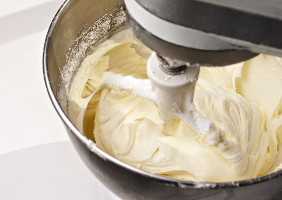 Mixer beating yellow cake icing