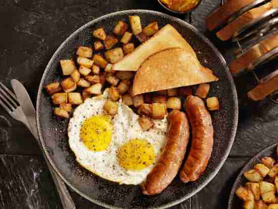 Breakfast with Sunny side up eggs, sausage, hash browns and toast-Photographed on Hasselblad H3D-39mb Camera