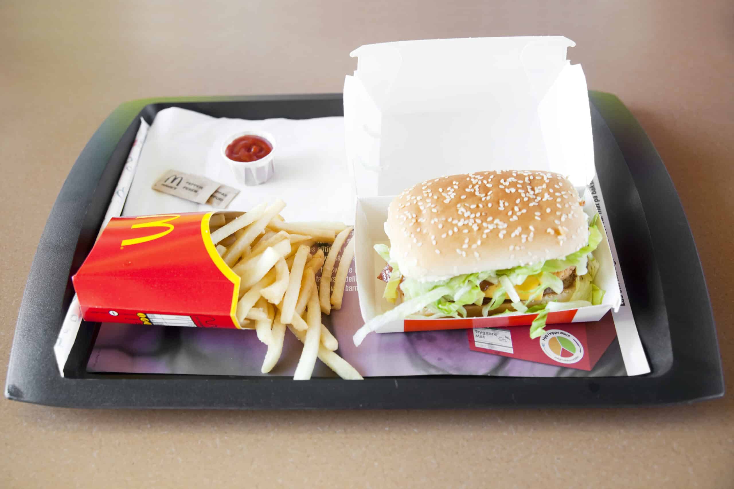 Åkersberga, Sweden - June 22th, 2011: McDonald's hamburger menu with Happy meal on a plate, in Sweden.