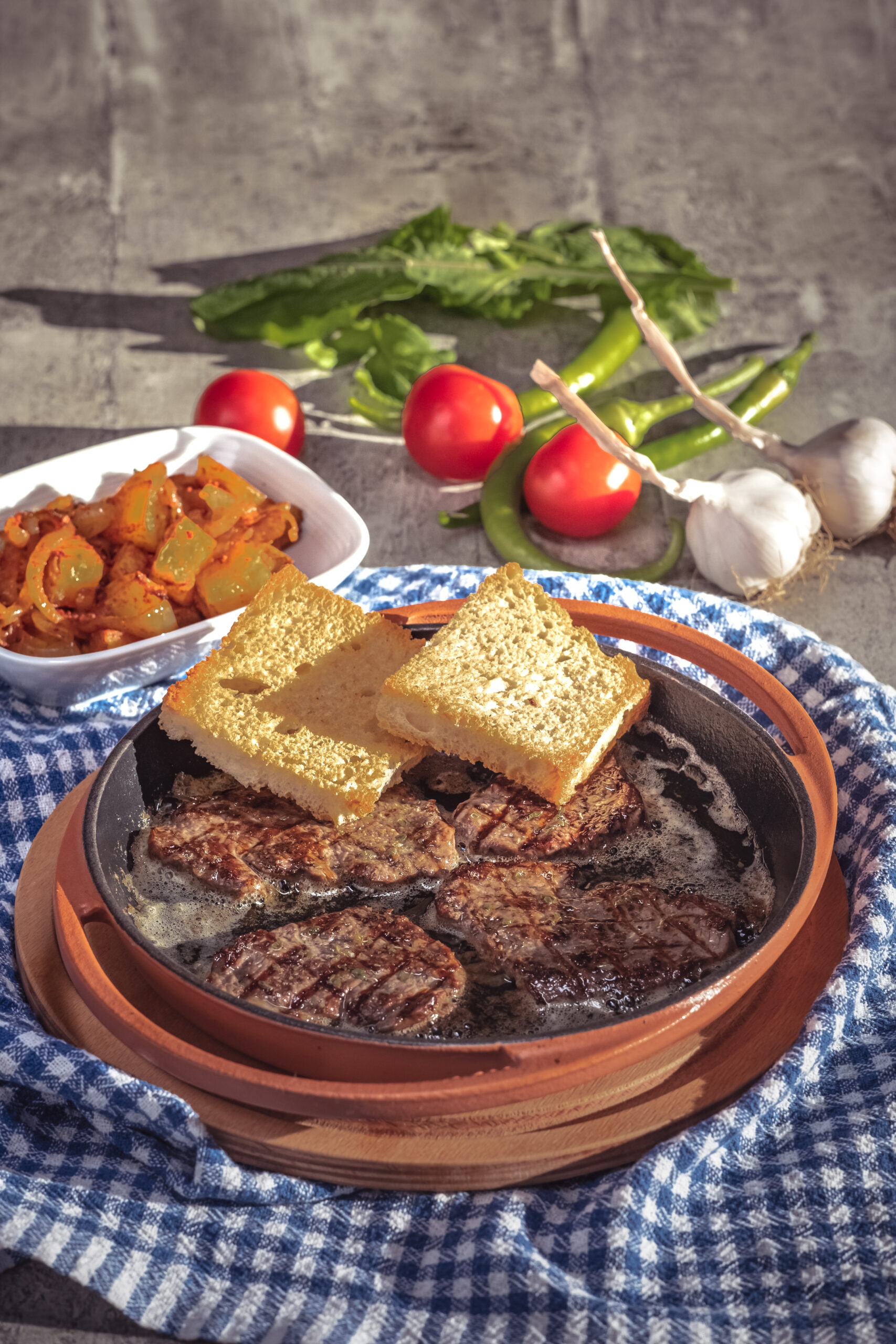 Grilled steak on frying pan and cornbread