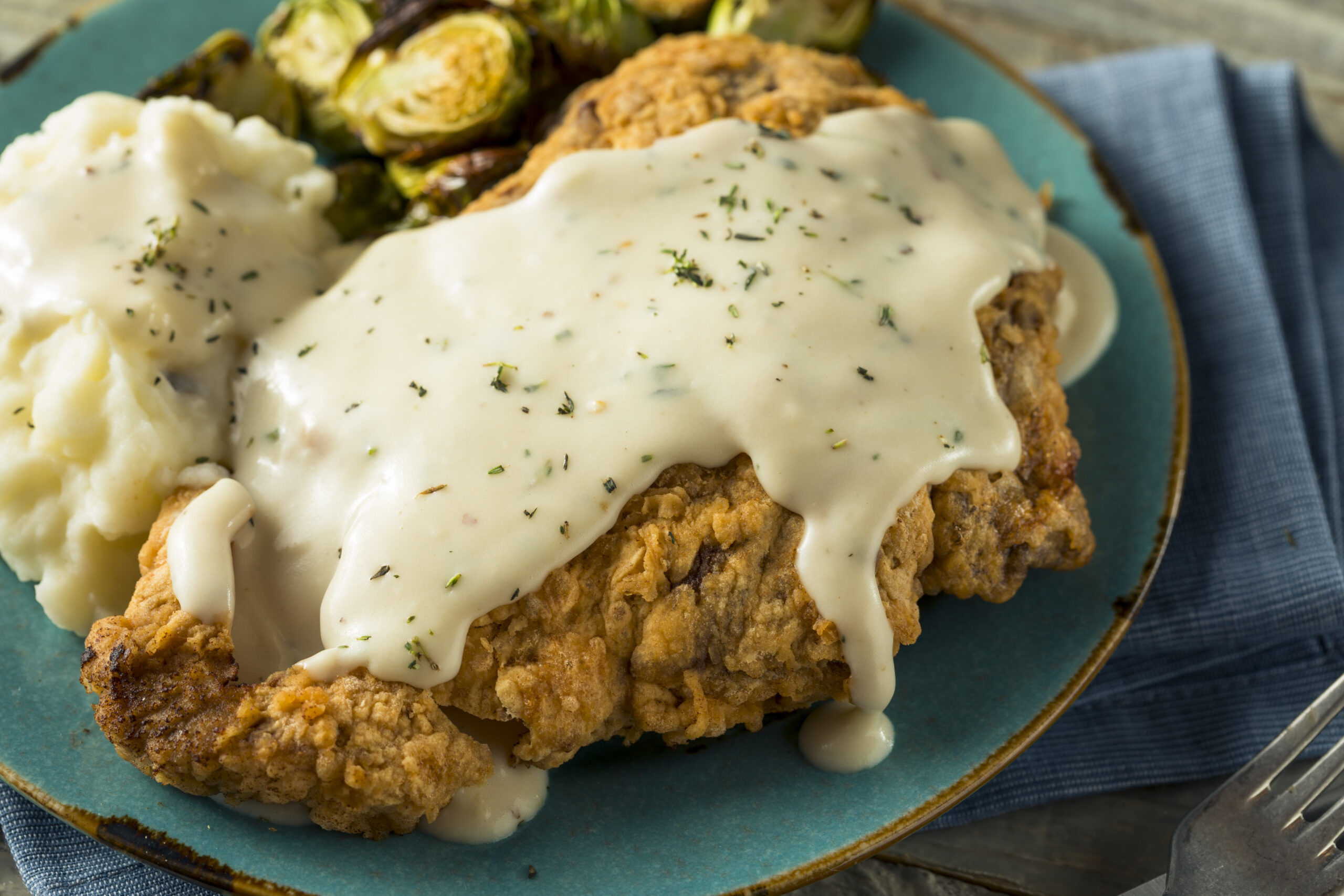 Homemade Country Fried Steak with Gravy and Potatoes