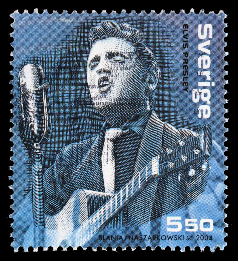 Sacramento, California, USA - January 11, 2011: 2004 Sweden postage stamp with an illustration of Elvis Aaron Presley (1935-1977) playing the guitar and singing into a microphone. The stamp was jointly designed by Piotr Naszarkowski and Czeslaw Slania.