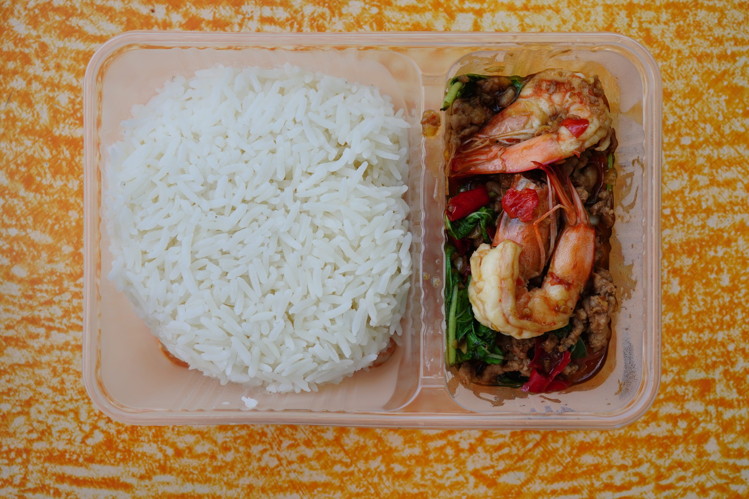 Thai Shrimp Pad Basil in box on table