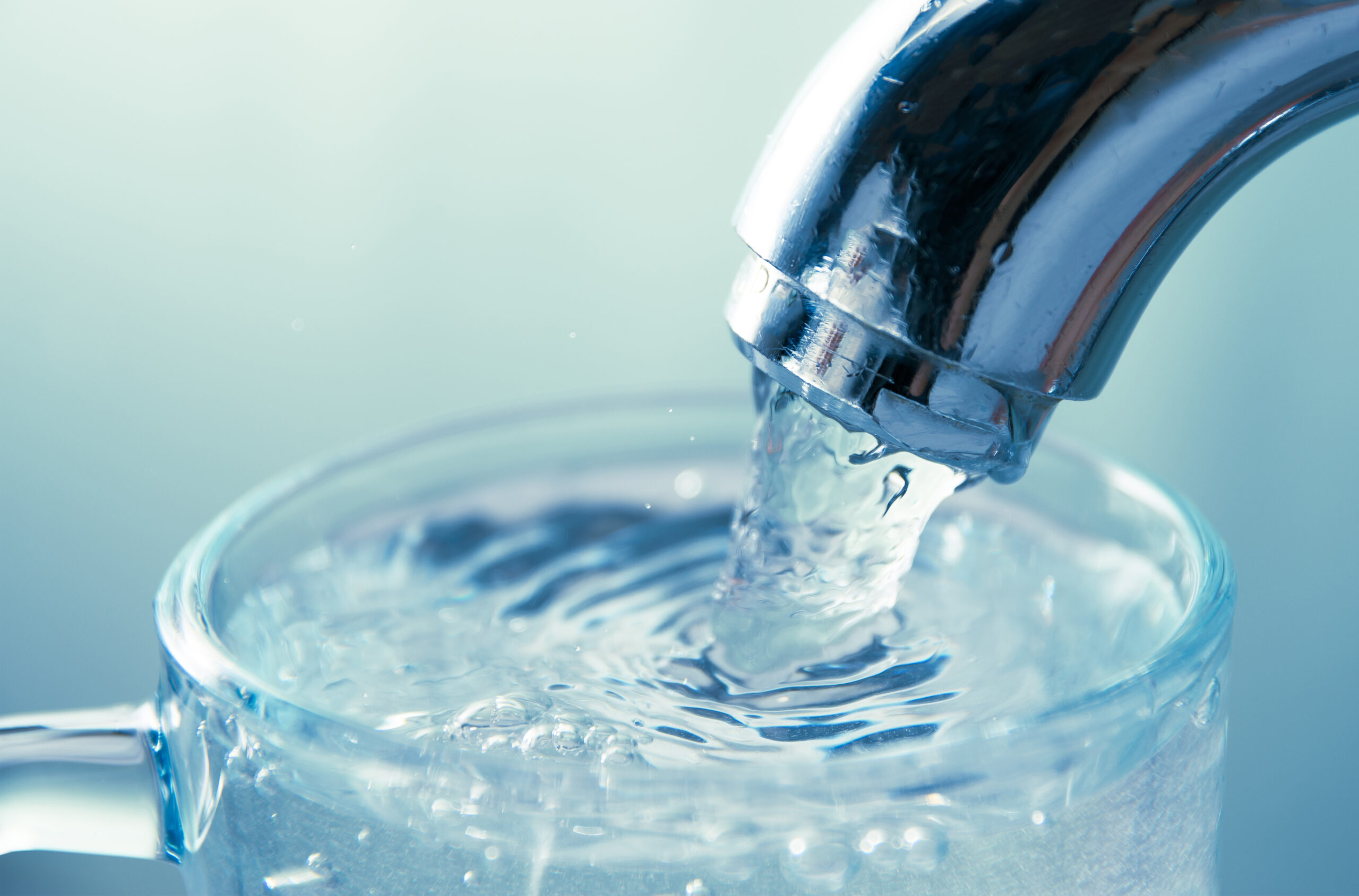 close-up view of water flowing from tap