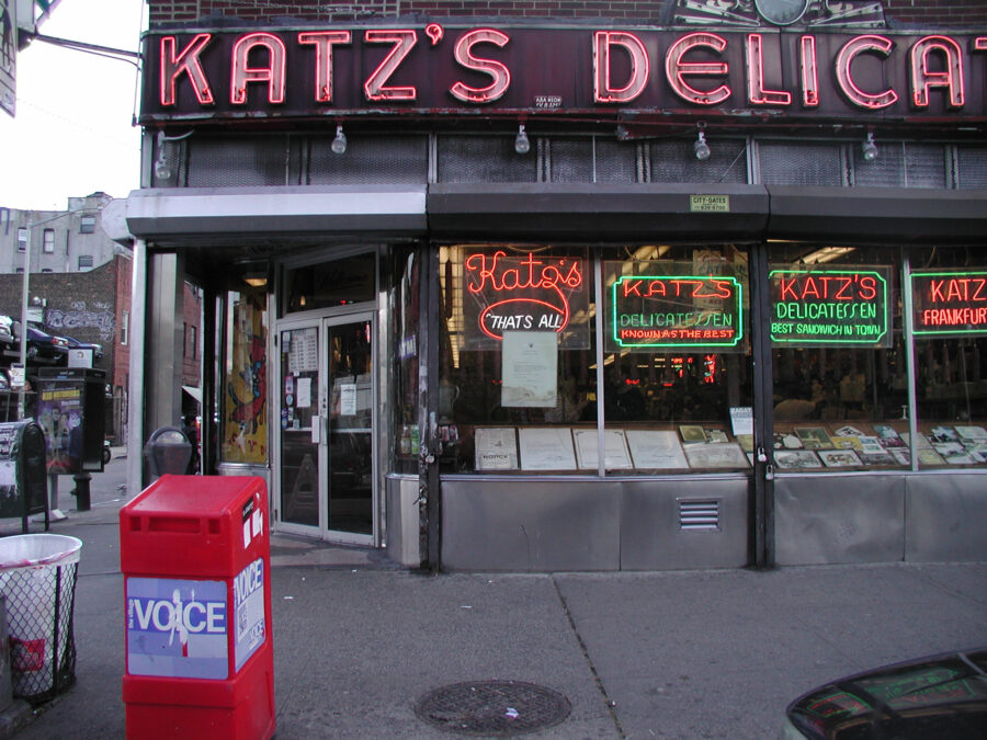 Katz's Deli on Ludow street,  Lower East Side, NYC. World famous for Pastrami sandwiches. Village Voice dispenser box, left.