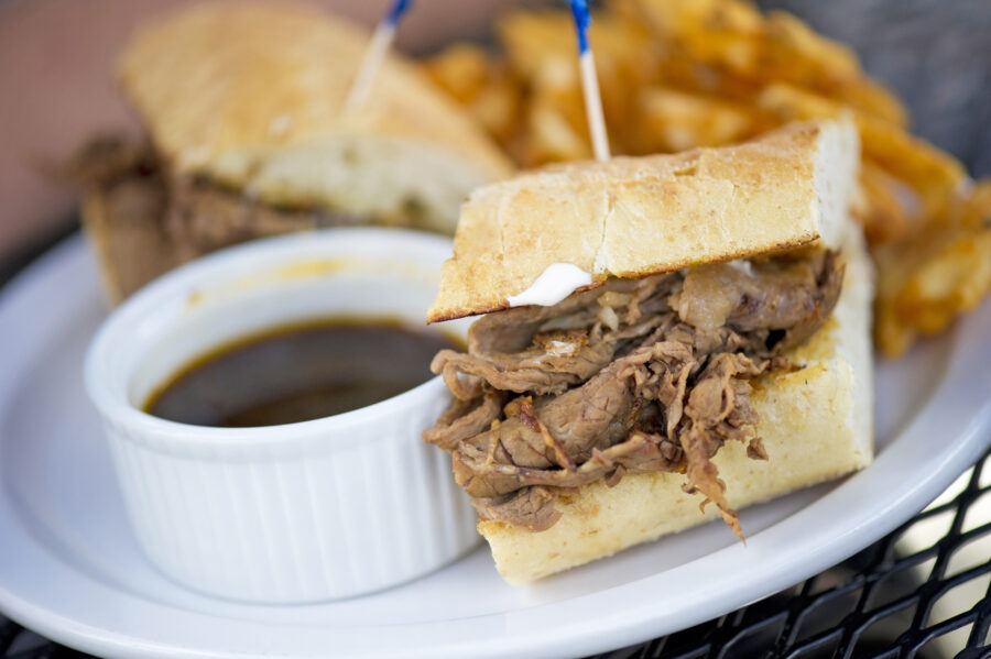 A classic beef dip sandwich and fries