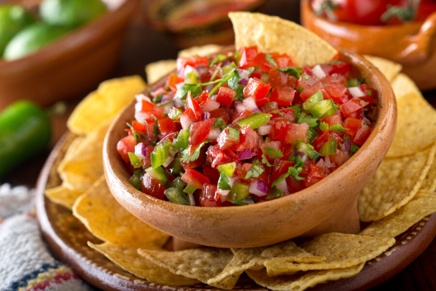 A delicious home made salsa pico de gallo with tomato, red onion, lime, cilantro, and jalapeno pepper.