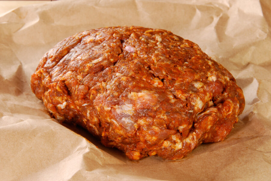 A mound of fresh gorund chorizo sausage on butcher paper