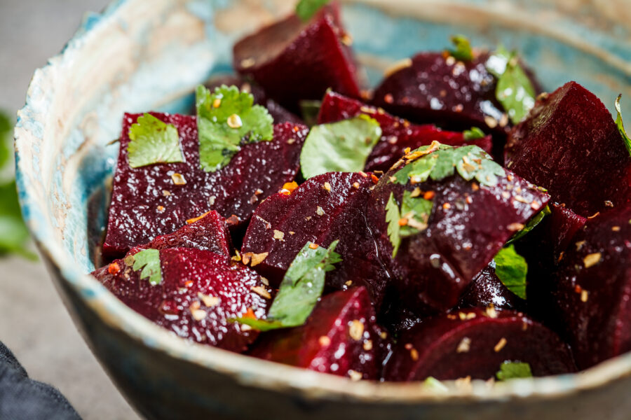 Baked beetroot salad with cilantro in a bowl.