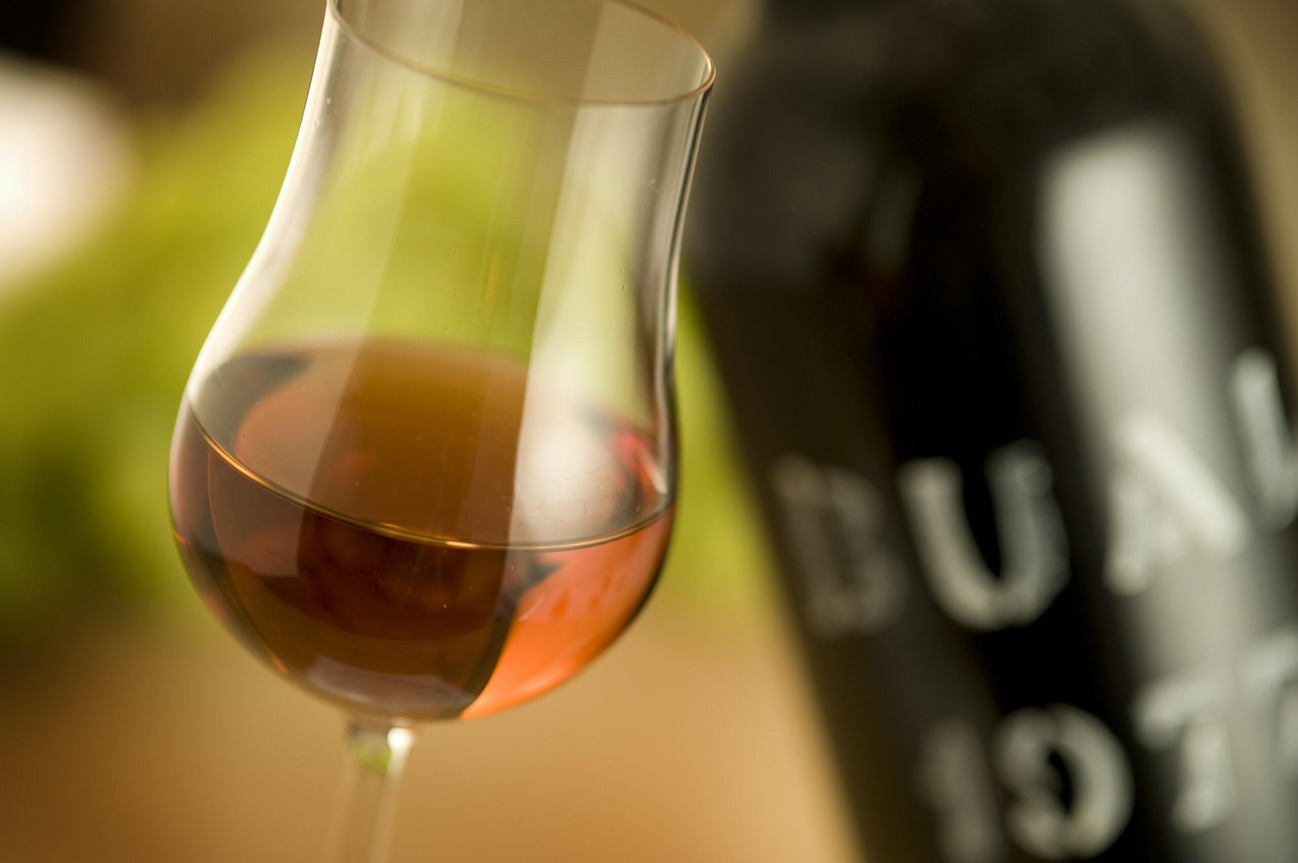 Close-up shot of a glass of Madeira Wine from 1977.