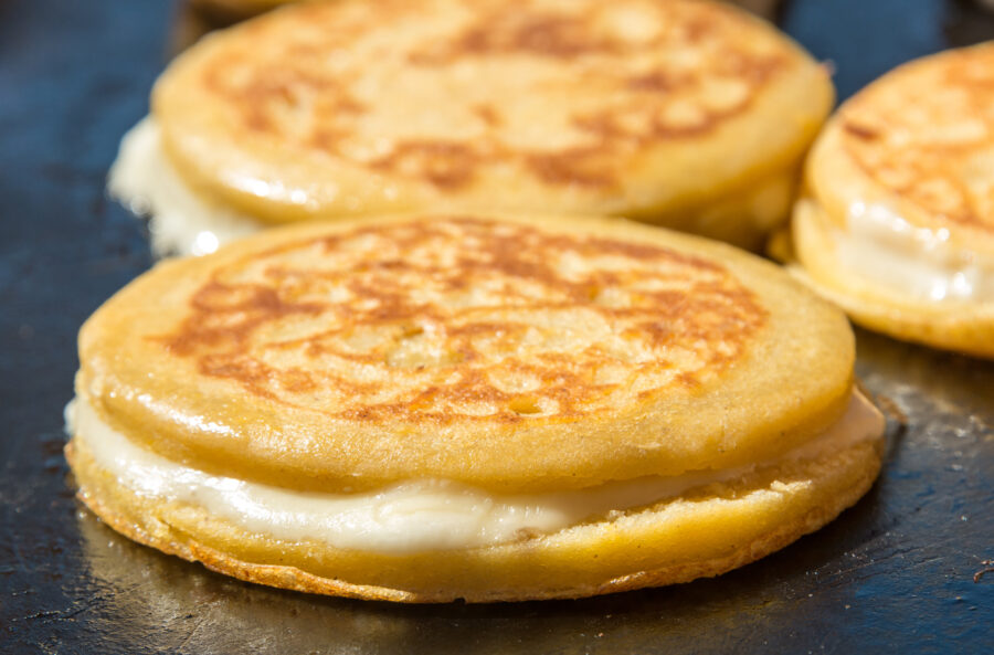 Cheese Arepas being cooked  in a Fast food stand in Bogota (Colombia)