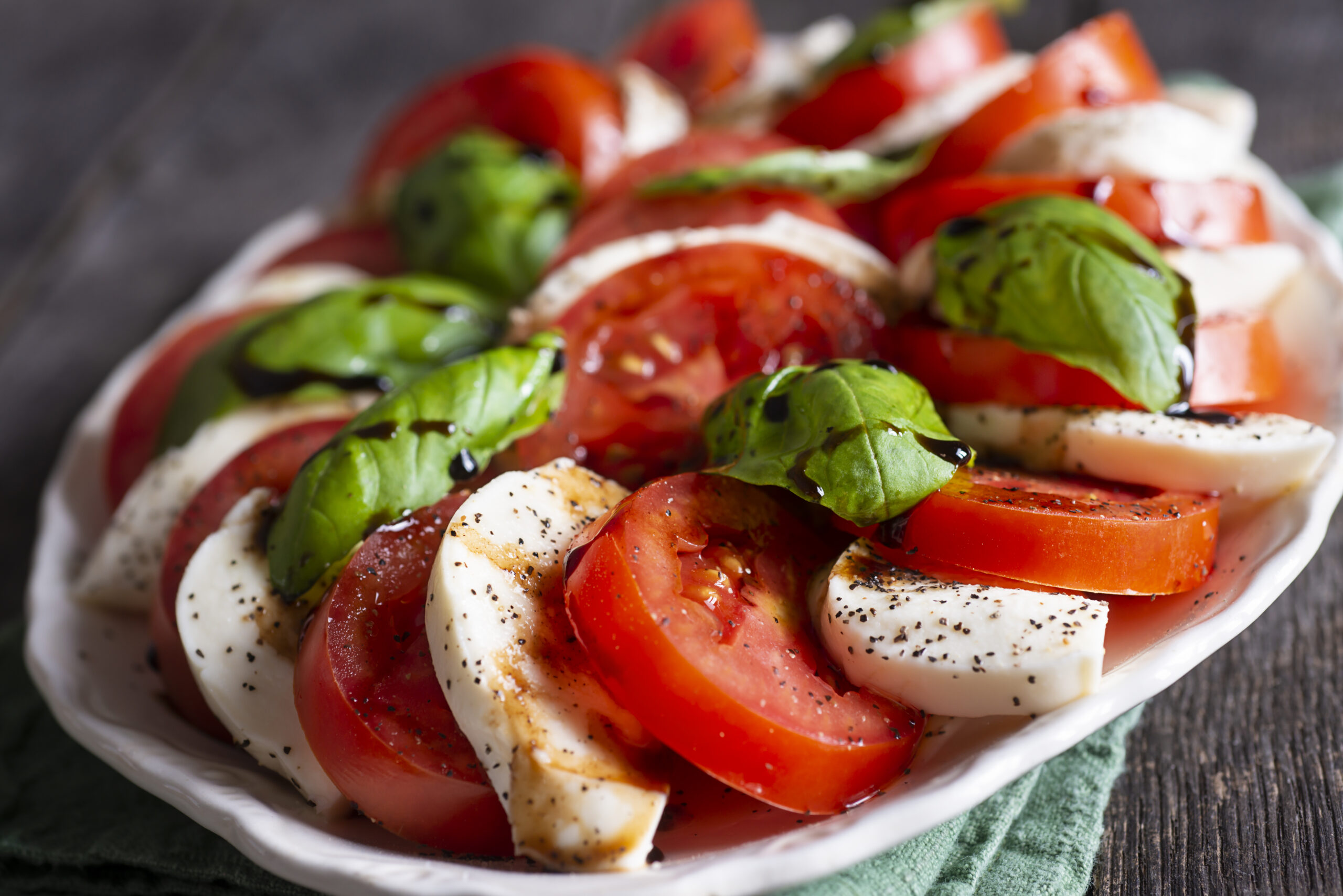 Classic Caprese Salad with Tomato, Mozzarella, Basil, Olive Oil and Balsamic Vinegar Glaze