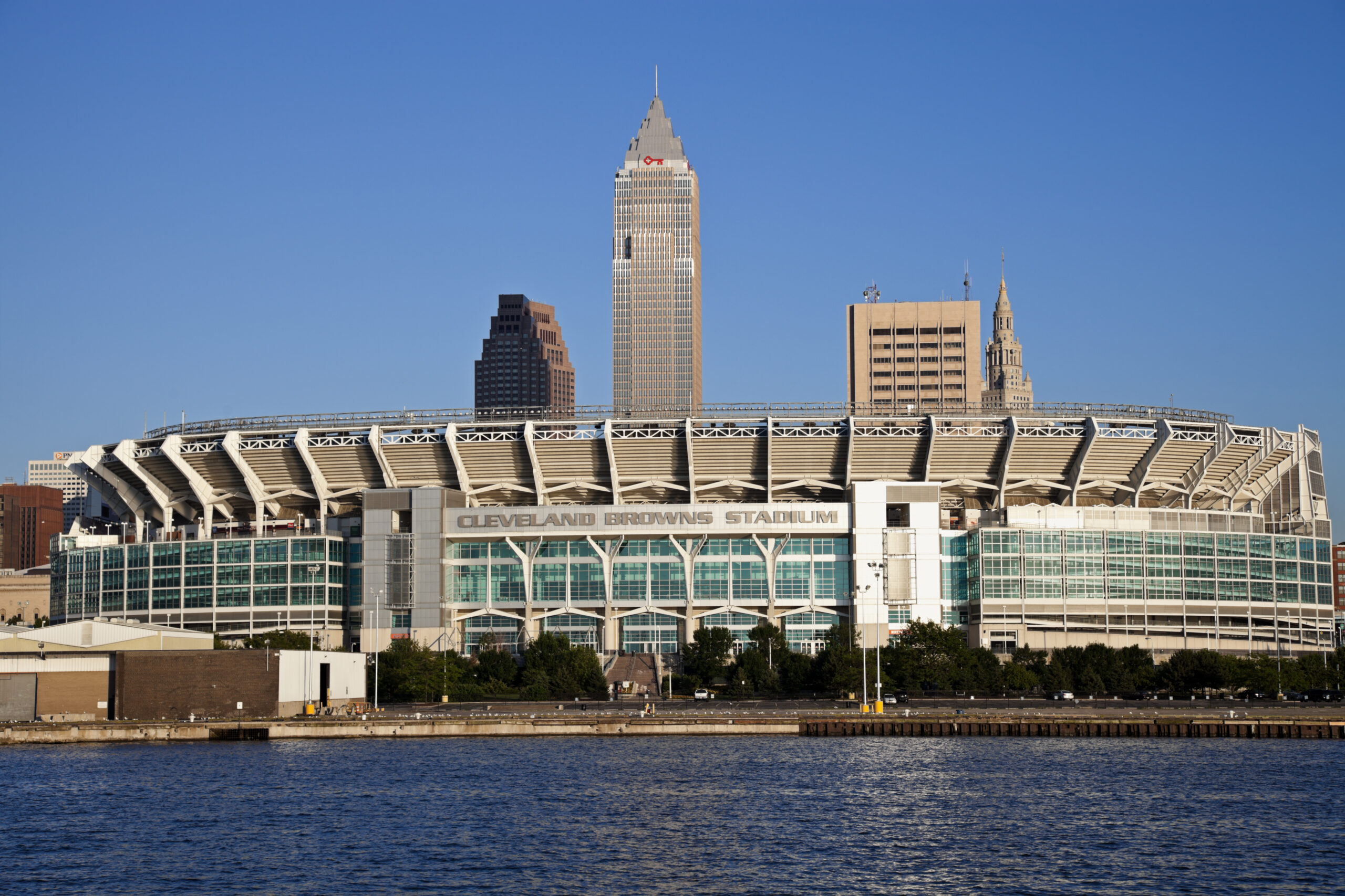 "Cleveland, Ohio, USA - June 17, 2010: Cleveland Browns stadium seen late afternoon from Lake Erie. The stadium was built in 1999 and allows 73000 people. Downtown Cleveland with Key Tower and Terminal Building in the background."