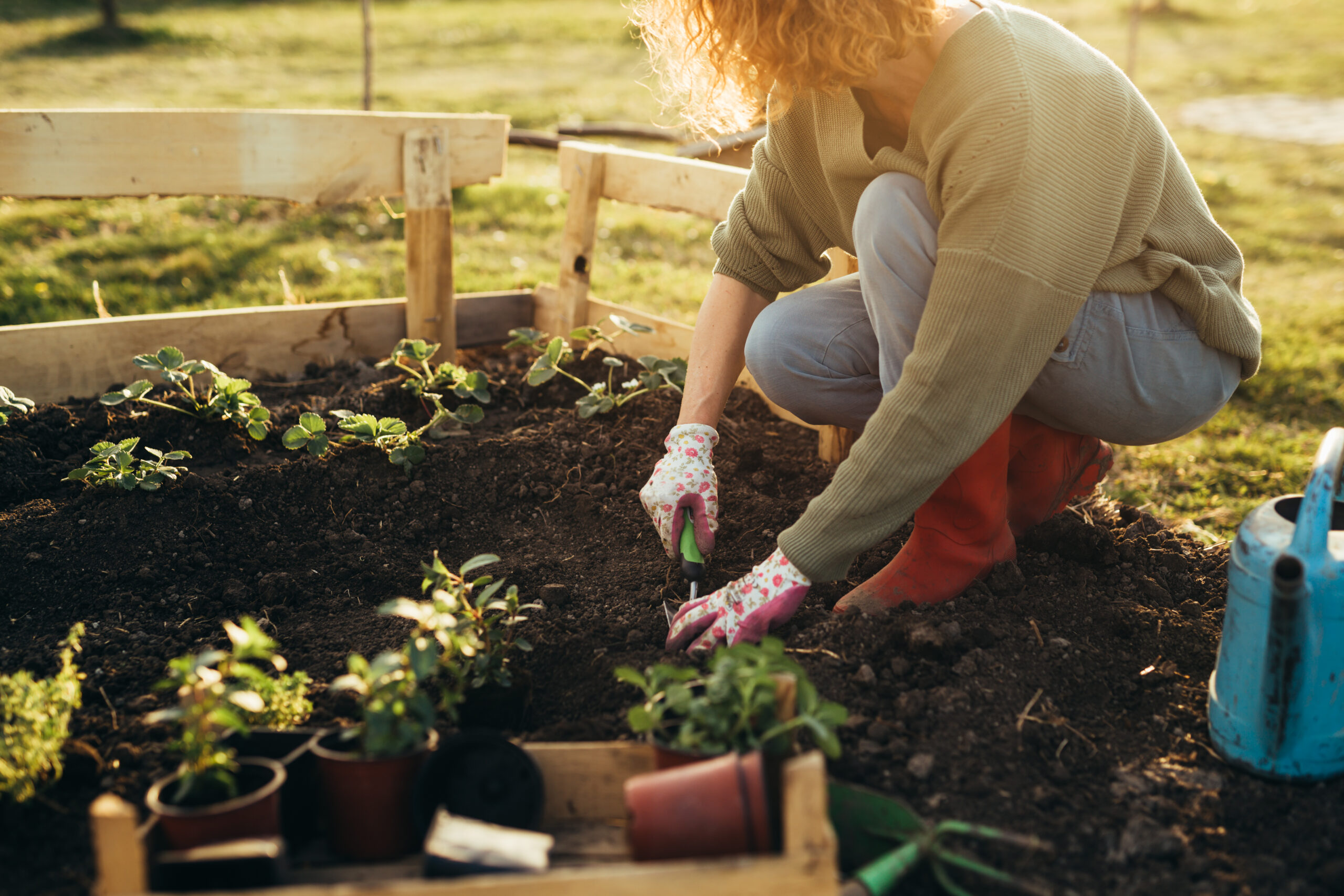 close up of woman feeling relaxed gardening in her garden