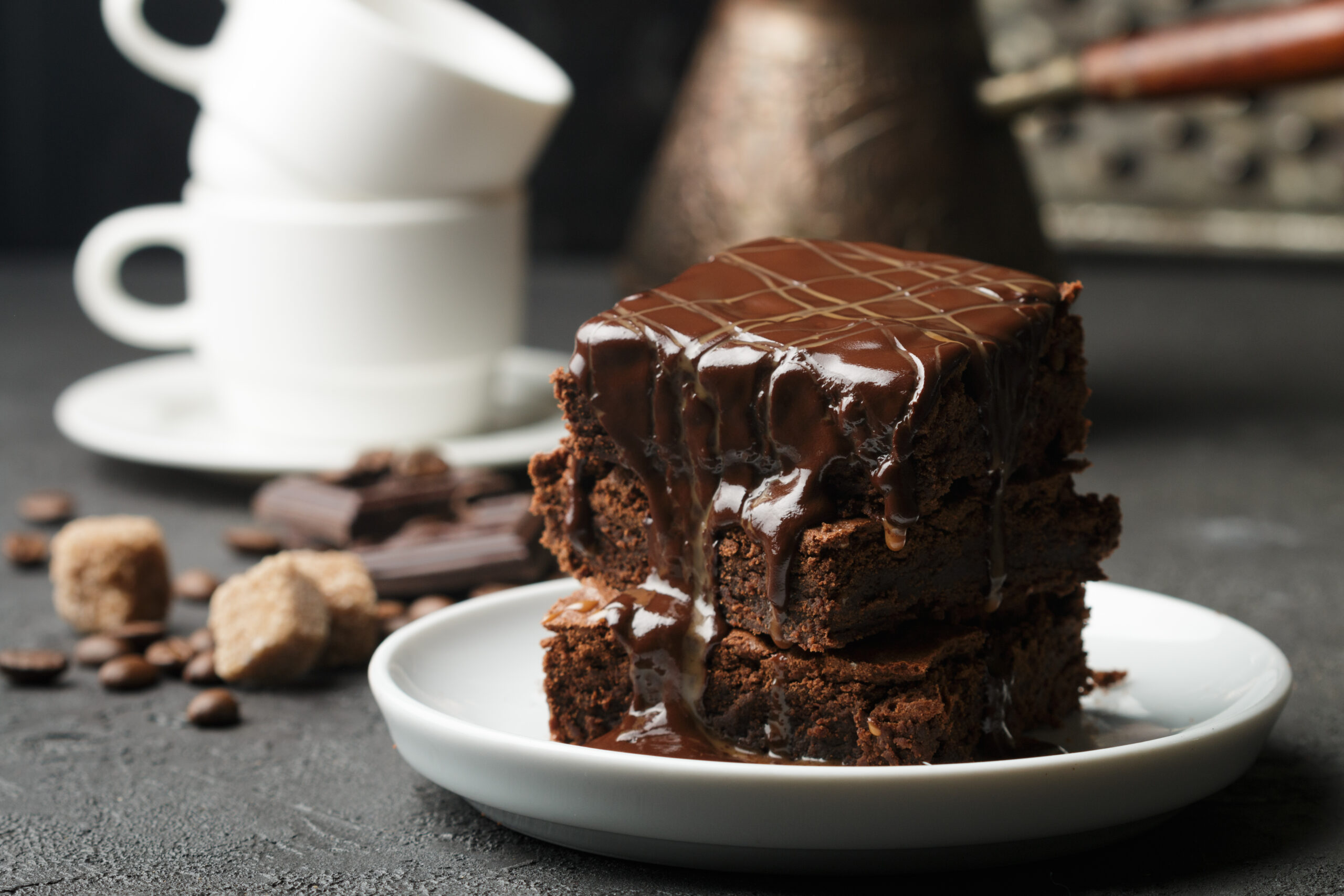 homemade brownie with chocolate sauce and caramel on the table. Selective focus