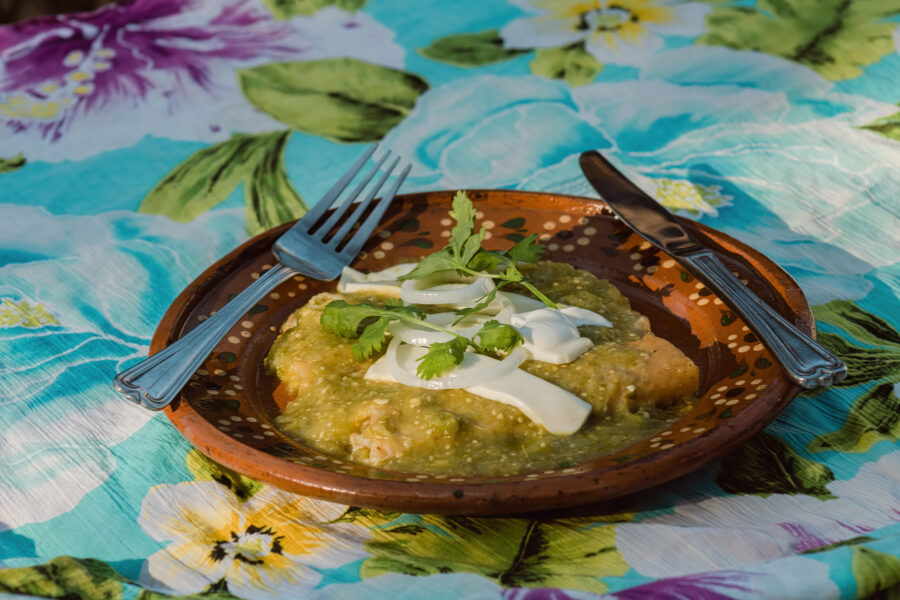 green enchiladas, served on exquisite dishware