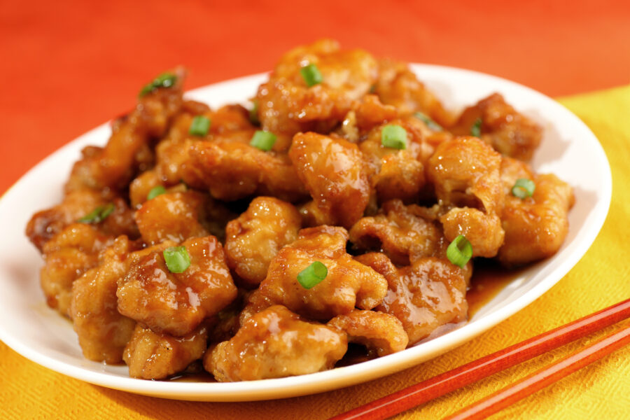 orange chicken in a white dish