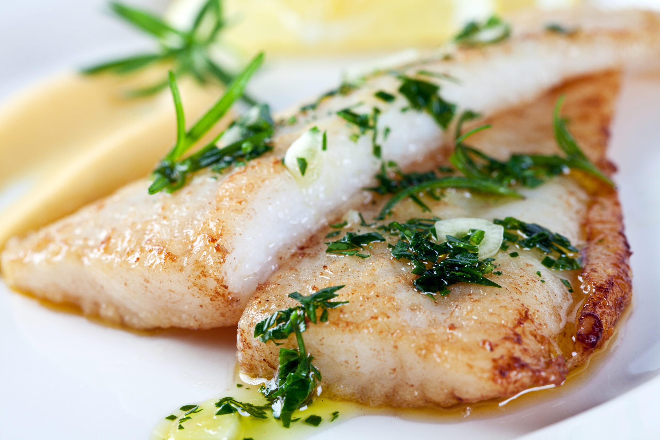 Fillet of branzino white fish with parsley, garlic, olive oil and lemon sauce.