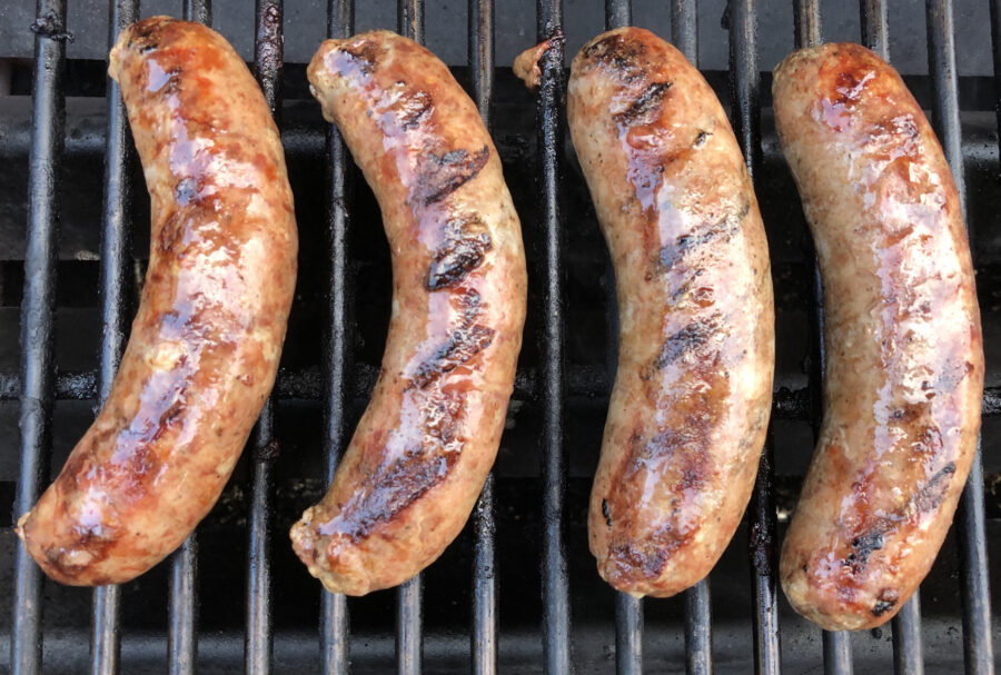 Grilled duck sausages on BBQ