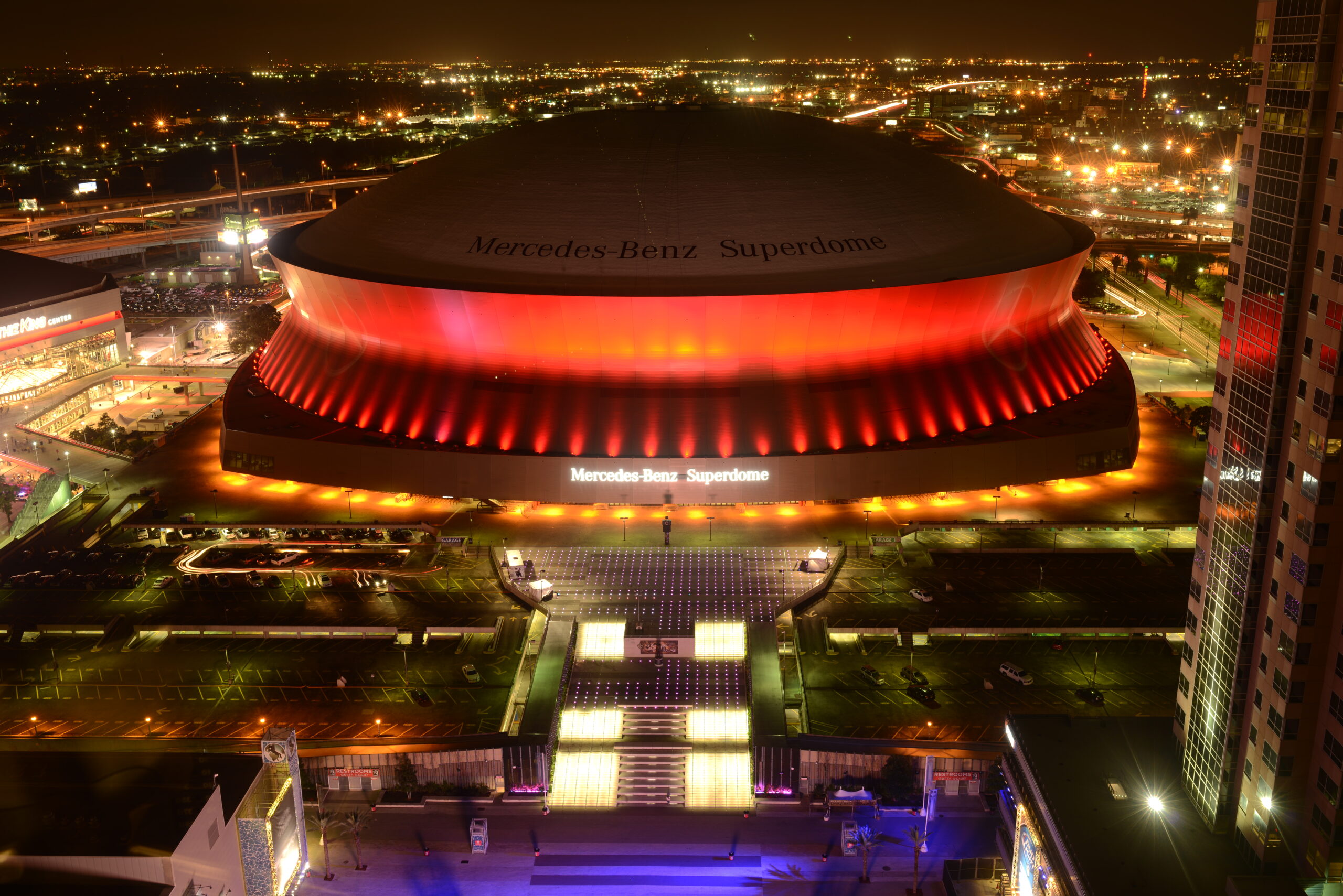 New Orleans, Louisiana, USA - October 28, 2014: At night, Mercedes-Benz Superdome, the home stadium of the New Orleans Saints football team, is lit up by the colorful neon lights.