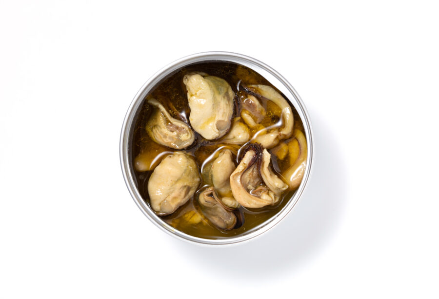 Open Can of oysters on white background.