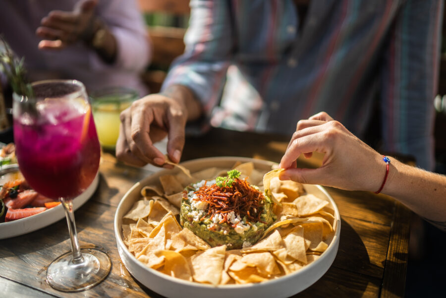 People eating guacamole at restaurant