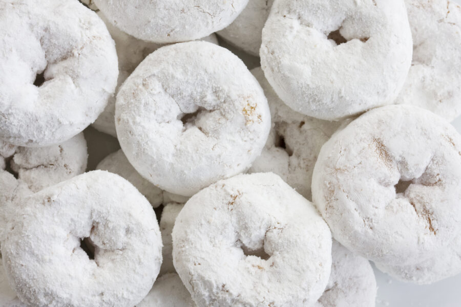 Plate of powdered sugar donuts